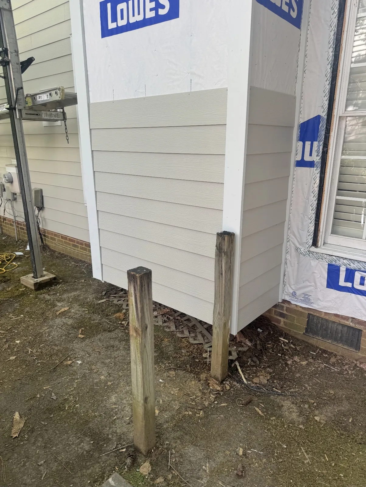 House wrap and lap siding at an outside wall corner
