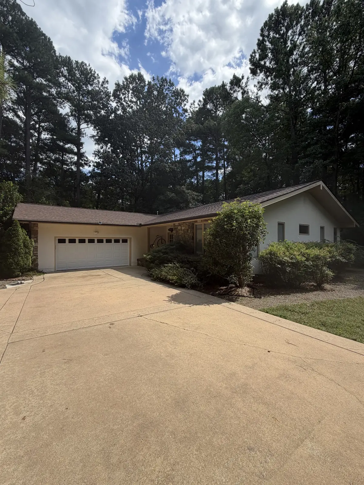 Single-story home with a two-car garage and shingle roof